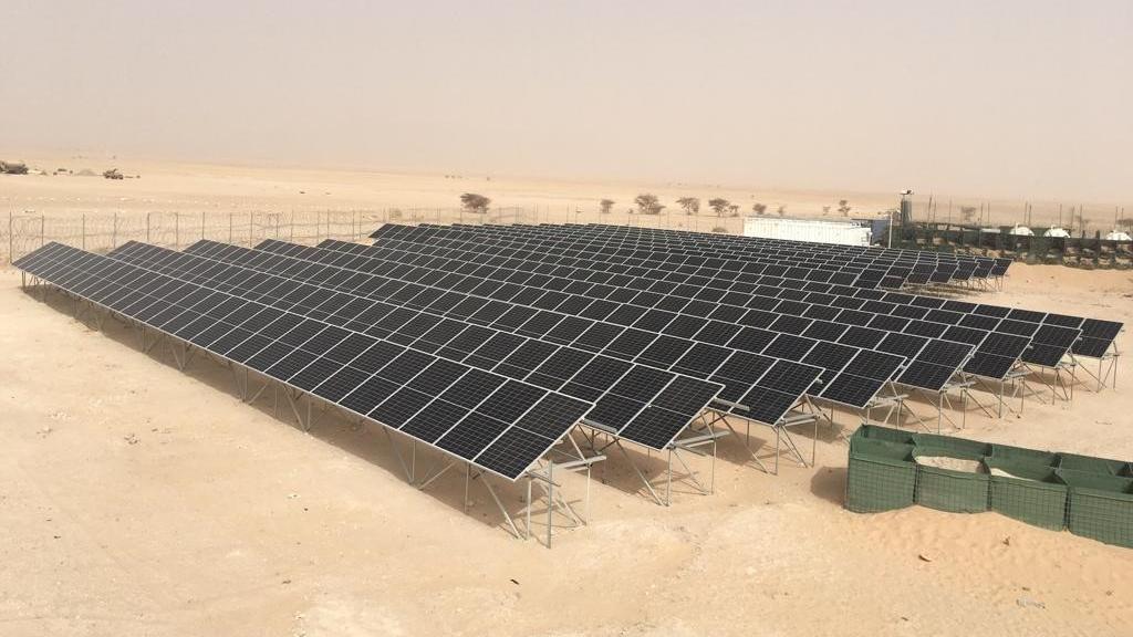Rows of solar panels on a UN base in the desert