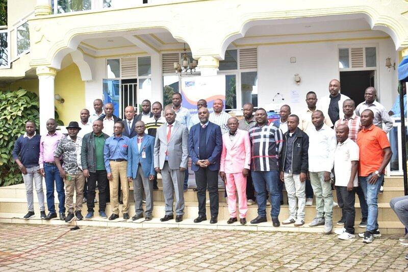 A group of representatives pose for a photograph.